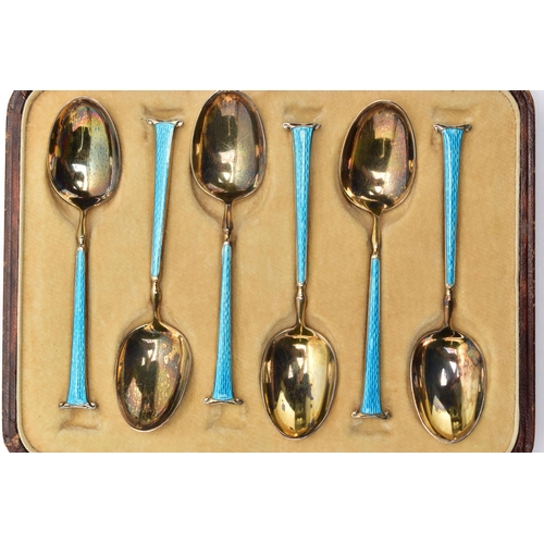 58 - A CASED SET OF SIX GEORGE V SILVER GILT AND ENAMEL COFFEE SPOONS, the handles engine turned and enam... 