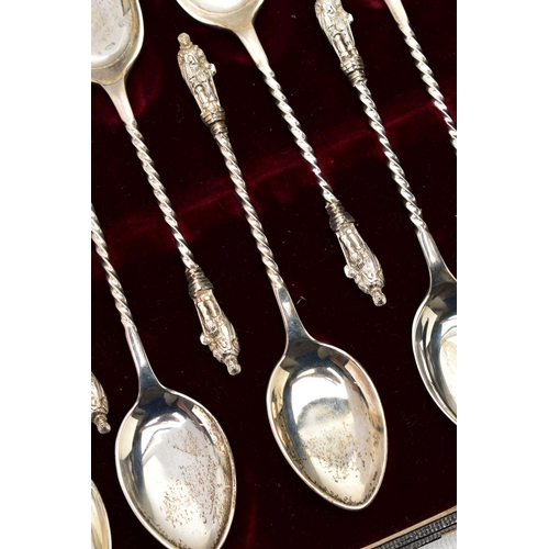 59 - A CASED SET OF TWELVE EDWARDIAN SILVER ICE CREAM SPOONS, Elizabethan male figure finial on a spiral ... 