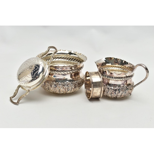 61 - A LATE VICTORIAN SILVER CREAM JUG AND SUGAR BOWL OF CIRCULAR FORM, crimped rims above a rope twist r... 