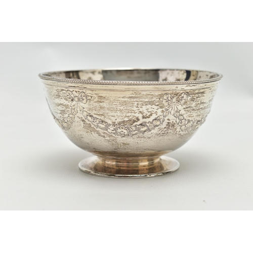 64 - A VICTORIAN SILVER PEDESTAL BOWL, the beaded rim above repousse decorated ribbons and swags, vacant ... 