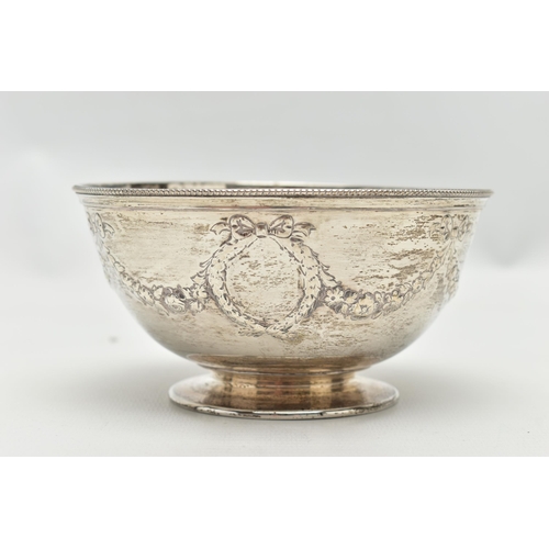 64 - A VICTORIAN SILVER PEDESTAL BOWL, the beaded rim above repousse decorated ribbons and swags, vacant ... 