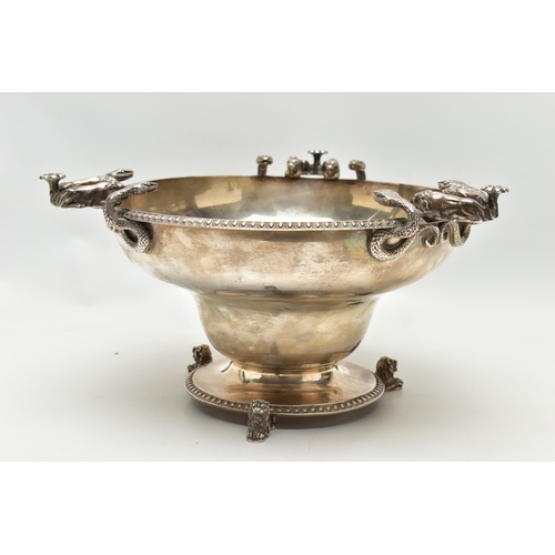 65 - A GEORGE V SILVER PEDESTAL BOWL, with three cast handles, each formed of two serpents and two lion d... 