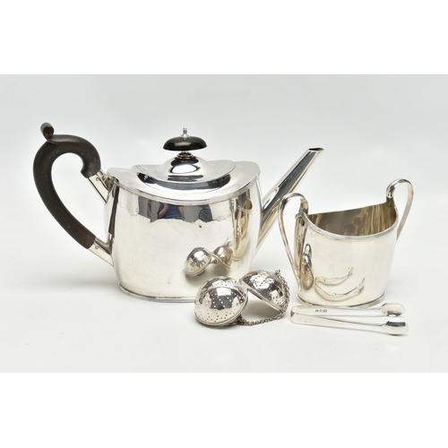 70 - A GEORGE V SILVER TWO PIECE TEA SET OF OVAL FORM, comprising teapot and sugar bowl with reeded rims,... 