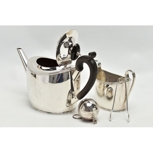 70 - A GEORGE V SILVER TWO PIECE TEA SET OF OVAL FORM, comprising teapot and sugar bowl with reeded rims,... 