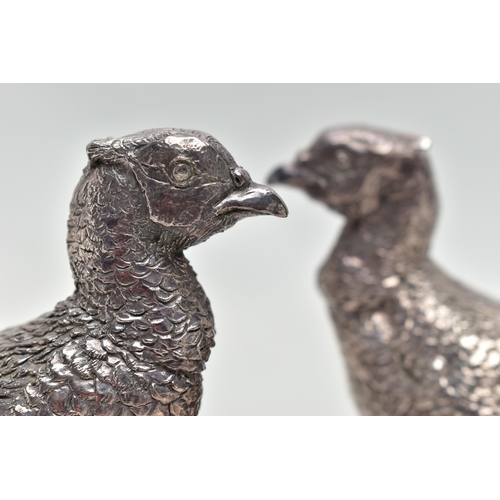 78 - A PAIR OF ELIZABETH II FILLED SILVER TABLE ORNAMENTS IN THE FORM OF COCK PHEASANTS STANDING ON A NAT... 