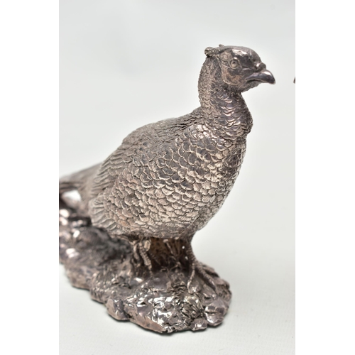 78 - A PAIR OF ELIZABETH II FILLED SILVER TABLE ORNAMENTS IN THE FORM OF COCK PHEASANTS STANDING ON A NAT... 