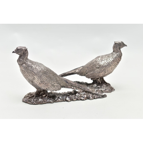 78 - A PAIR OF ELIZABETH II FILLED SILVER TABLE ORNAMENTS IN THE FORM OF COCK PHEASANTS STANDING ON A NAT... 