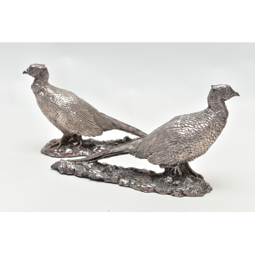 78 - A PAIR OF ELIZABETH II FILLED SILVER TABLE ORNAMENTS IN THE FORM OF COCK PHEASANTS STANDING ON A NAT... 