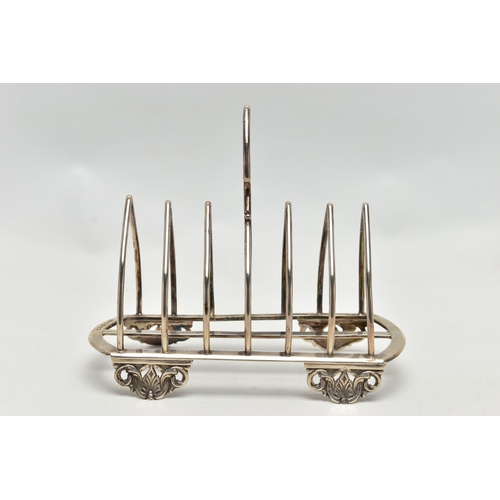 79 - A VICTORIAN SILVER SIX DIVISION TOAST RACK, triangular handle with beaded decoration over seven arch... 