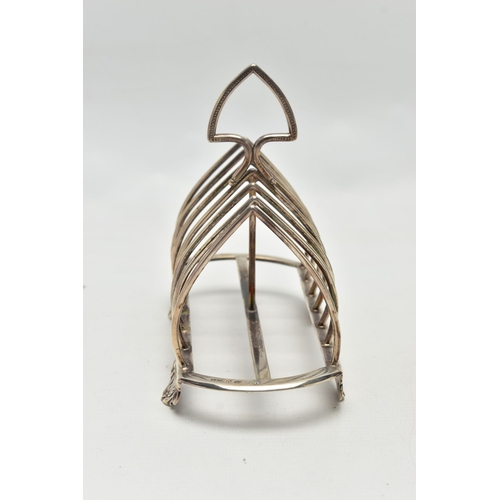 79 - A VICTORIAN SILVER SIX DIVISION TOAST RACK, triangular handle with beaded decoration over seven arch... 