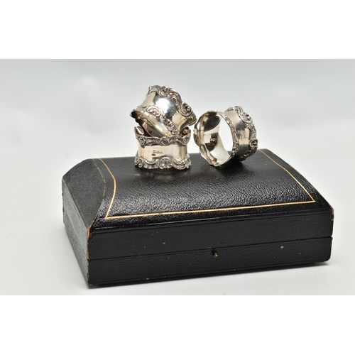 80 - A CASED SET OF SIX GEORGE V SILVER NAPKIN RINGS, of circular form cast with scrolled rims, maker's m... 