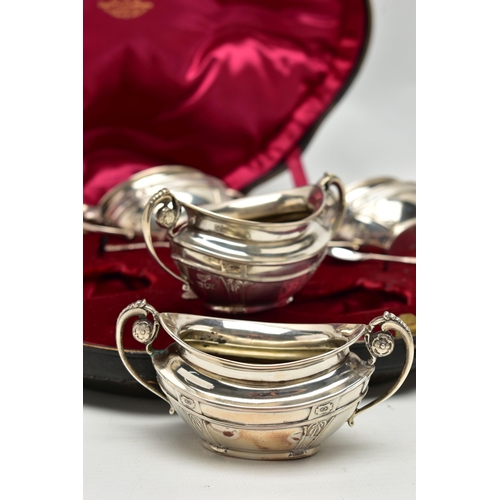 81 - A CASED SET OF FOUR EDWARDIAN GOLDSMITHS & SILVERSMITHS CO LTD SILVER SALTS, of twin handled oval fo... 