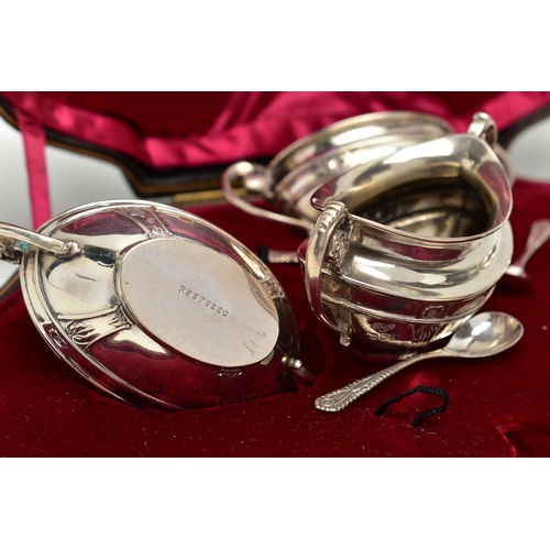 81 - A CASED SET OF FOUR EDWARDIAN GOLDSMITHS & SILVERSMITHS CO LTD SILVER SALTS, of twin handled oval fo... 