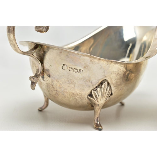 82 - THREE 20TH CENTURY OVAL SILVER SAUCE BOATS OF VARYING DESIGNS, one on an oval foot, stamped 987L to ... 