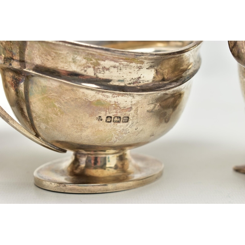 82 - THREE 20TH CENTURY OVAL SILVER SAUCE BOATS OF VARYING DESIGNS, one on an oval foot, stamped 987L to ... 