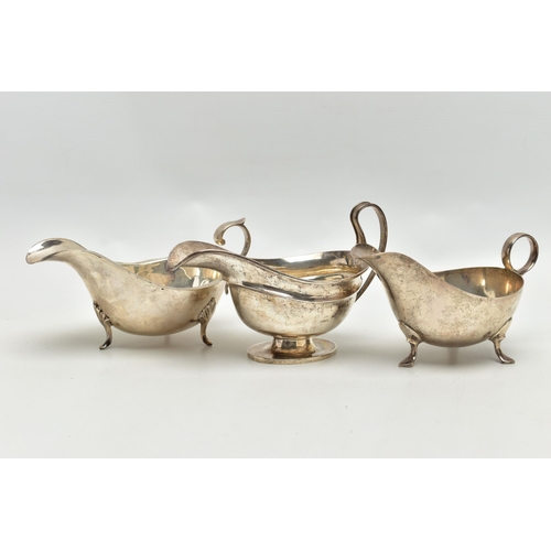 82 - THREE 20TH CENTURY OVAL SILVER SAUCE BOATS OF VARYING DESIGNS, one on an oval foot, stamped 987L to ... 