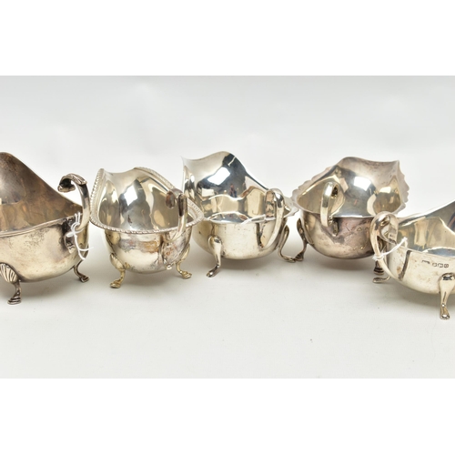 83 - FIVE 20TH CENTURY SILVER SAUCE BOATS OF VARYING DESIGNS, all on three cabriole legs, one with gadroo... 