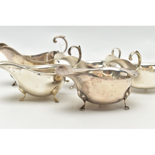 83 - FIVE 20TH CENTURY SILVER SAUCE BOATS OF VARYING DESIGNS, all on three cabriole legs, one with gadroo... 