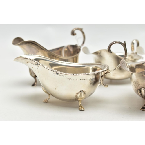 83 - FIVE 20TH CENTURY SILVER SAUCE BOATS OF VARYING DESIGNS, all on three cabriole legs, one with gadroo... 