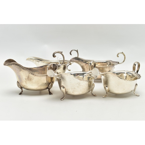 83 - FIVE 20TH CENTURY SILVER SAUCE BOATS OF VARYING DESIGNS, all on three cabriole legs, one with gadroo... 