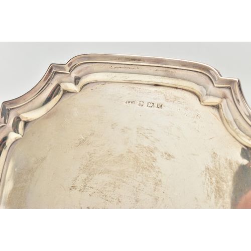 84 - AN ELIZABETH II SILVER WAITER OF SHAPED SQUARE FORM, with pie crust rim, rubbed presentation inscrip... 