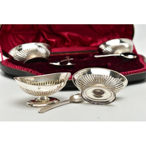 85 - A CASED SET OF FOUR VICTORIAN SILVER PEDESTAL SALTS WITH SPOONS, the salts of oval form with stop re... 