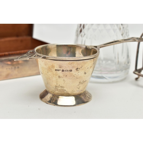 94 - A SMALL PARCEL OF 20TH CENTURY SILVER, comprising a George VI tea strainer with conical stand, maker... 