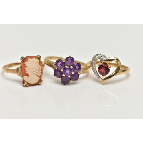 10 - THREE 9CT GOLD GEM SET RINGS, the first a garnet and single cut diamond, openwork heart ring, hallma... 