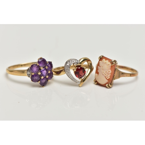 10 - THREE 9CT GOLD GEM SET RINGS, the first a garnet and single cut diamond, openwork heart ring, hallma... 