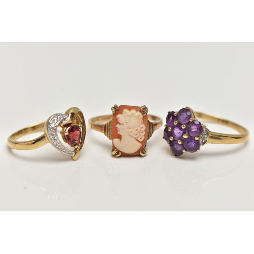 10 - THREE 9CT GOLD GEM SET RINGS, the first a garnet and single cut diamond, openwork heart ring, hallma... 