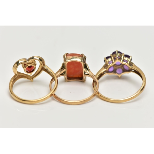 10 - THREE 9CT GOLD GEM SET RINGS, the first a garnet and single cut diamond, openwork heart ring, hallma... 