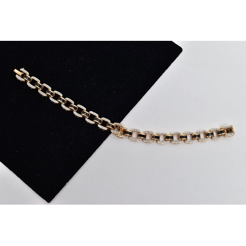 14 - AN 18CT YELLOW GOLD, SAPPHIRE AND DIAMOND LINE BRACELET, designed with a series of openwork square l... 