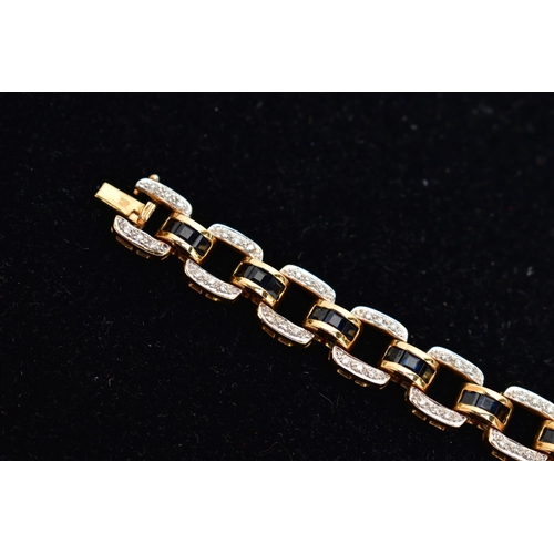 14 - AN 18CT YELLOW GOLD, SAPPHIRE AND DIAMOND LINE BRACELET, designed with a series of openwork square l... 