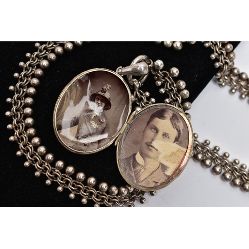 28 - A LATE 19TH CENTURY LOCKET AND CHAIN, oval form silver locket detailed with a belt and buckle design... 