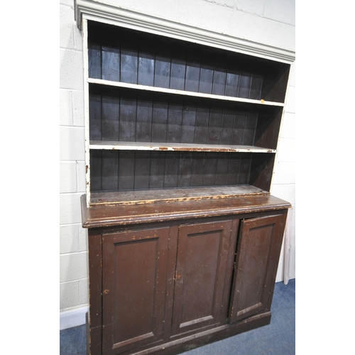 1211 - A 19TH CENTURY PAINTED PINE BOOKCASE, the open shelving top, above a base with triple panelled cupbo... 