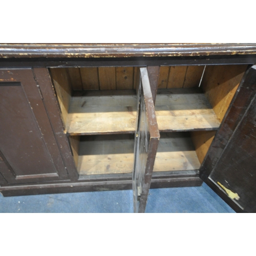 1211 - A 19TH CENTURY PAINTED PINE BOOKCASE, the open shelving top, above a base with triple panelled cupbo... 