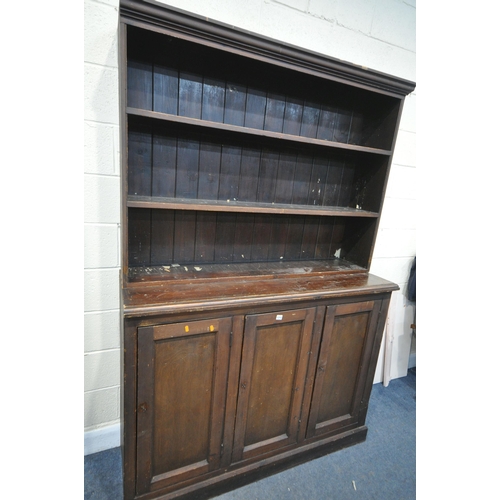 1212 - A 19TH CENTURY PAINTED PINE BOOKCASE, the open shelving top, above a base with triple panelled cupbo... 