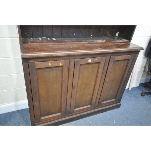 1212 - A 19TH CENTURY PAINTED PINE BOOKCASE, the open shelving top, above a base with triple panelled cupbo... 