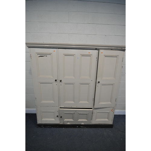 1213 - A 19TH CENTURY PAINTED PINE HOUSEKEEPERS CUPBOARD, with three panelled cupboard doors, enclosing an ... 