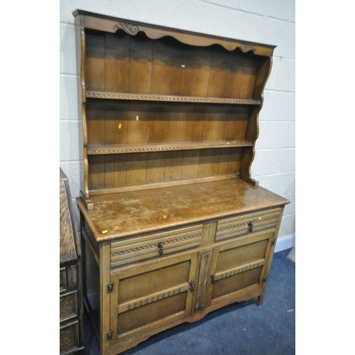 1215 - AN OAK DRESSER, with two drawers, width 126cm x depth 48cm x height 179cm (condition:-water stains) ... 