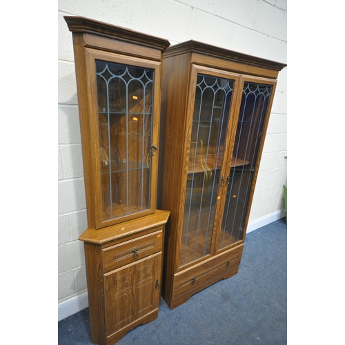 1280 - AN OAK FINISH TWO DOOR BOOKCASE, width 86cm x depth 40cm x height 187cm, and a matching corner unit ... 