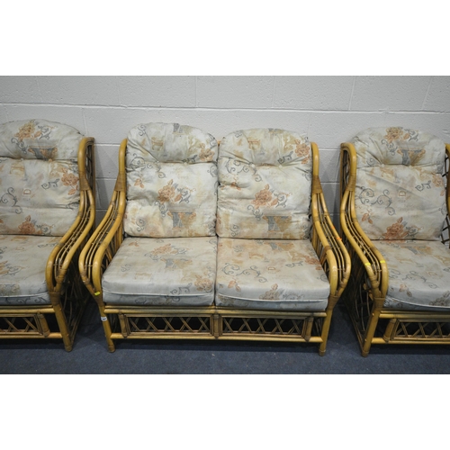 1281 - A WICKER THREE PIECE CONSERVATORY SUITE, comprising a two seater sofa, length 130cm, and two armchai... 