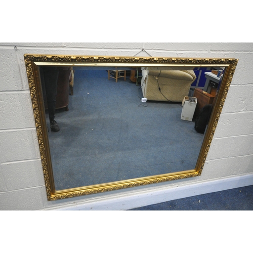 1290 - A LARGE GILT FRAMED BEVELLED EDGE WALL MIRROR, 127cm x 99cm