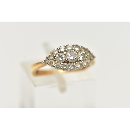 22 - AN 18CT GOLD DIAMOND CLUSTER RING, a navette shaped cluster ring comprised of nineteen round brillia... 