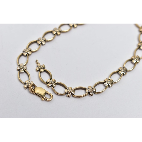 3 - A 9CT GOLD DIAMOND BRACELET, designed with a series of oval openwork links, interspaced with cross l... 