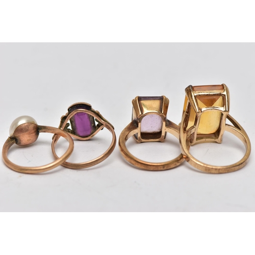 31 - FOUR GEM SET RINGS, the first a 9ct yellow gold ring, set with a large rectangular cut citrine, appr... 