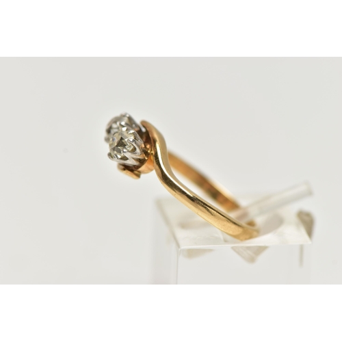 36 - A TWO STONE DIAMOND CROSSOVER RING, two old cut diamonds each within eight claw settings within a cr... 