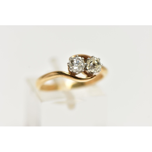 36 - A TWO STONE DIAMOND CROSSOVER RING, two old cut diamonds each within eight claw settings within a cr... 