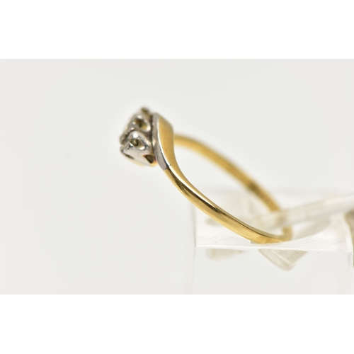 49 - A YELLOW METAL THREE STONE DIAMOND RING, designed with a central claw set, round brilliant cut diamo... 