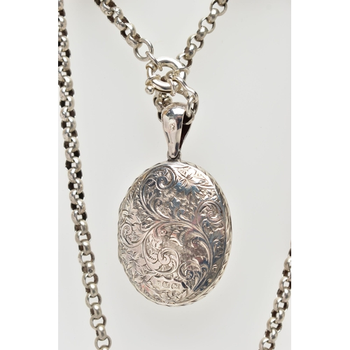 6 - A LATE VICTORIAN SILVER LOCKET AND A WHITE METAL BELCHER CHAIN, the oval hinged locket, decorated wi... 